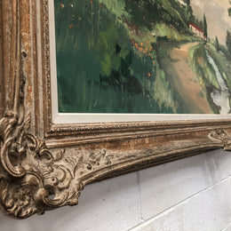 Lovely framed French signed oil on canvas of a country scene in a ornate decorative frame and is in good original condition.