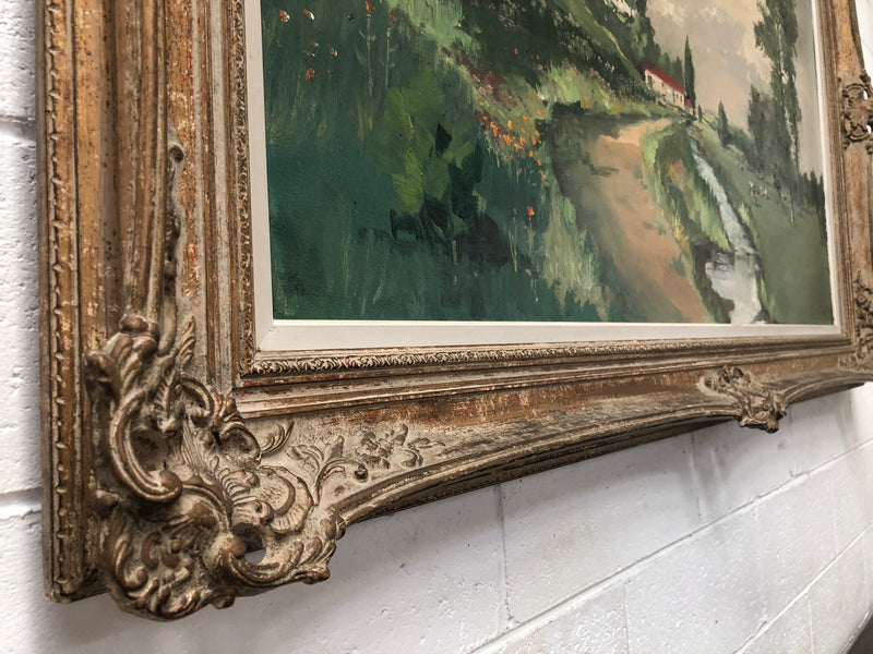 Lovely framed French signed oil on canvas of a country scene in a ornate decorative frame and is in good original condition.