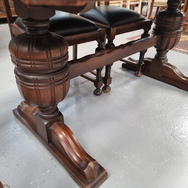Tudor oak dining setting consisting of draw leaf extension table, 4 dining chairs and 2 carver chairs. Upholstery in excellent condition. Circa: 1930’s. The table, chair and carver chairs are in good original detailed condition.