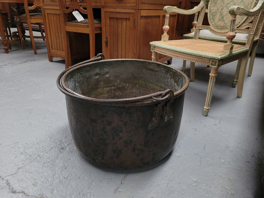Sourced in France is this large Antique French brass firewood pot with handle. It is in original condition with some signs of wear please view photos.