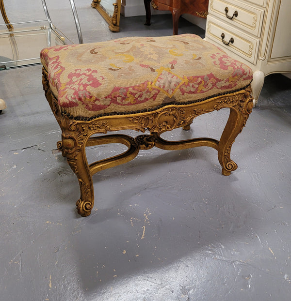 Charming 19th Century gilt wood tapestry covered Louis XV style stool. It has a beautifully carved base and undercarriage and it has been sourced from France. It is in good original detailed condition, please view photos of tapestry has they help form part of the description.