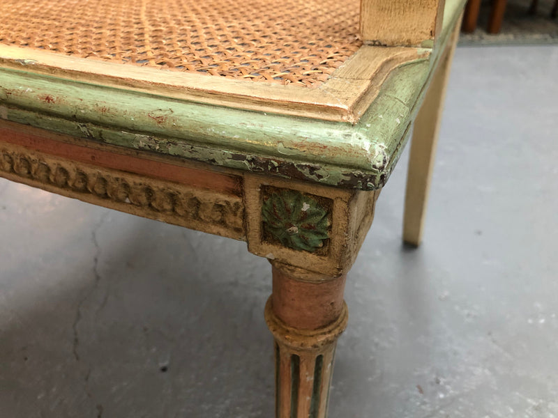 Painted French Louis XVI style cane panel arm chair. Paint is original and it is in very good original condition.