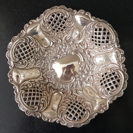 A Sheffield sterling silver bowl with repousse pattern, hallmarked WALKER & HALL and in good original condition.