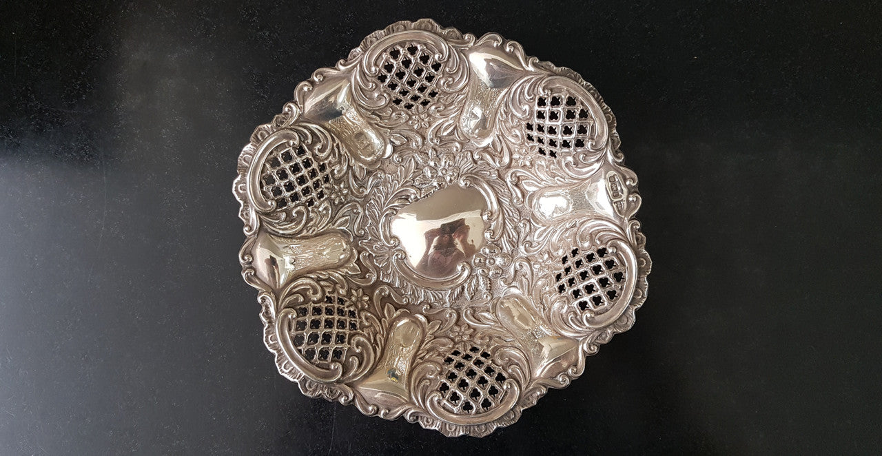 A Sheffield sterling silver bowl with repousse pattern, hallmarked WALKER & HALL and in good original condition.