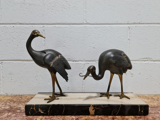Fabulous French Art Deco cold painted spelter Ibis birds on a stylized Art Deco marble base. Signed "Rochard" circa 1930's. In good original detailed condition.