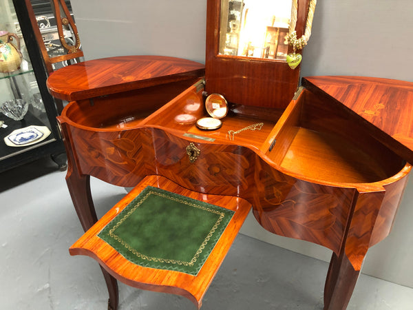 French Mahogany hidden dressing table with beautiful marquetry inlay. In good restored condition. Circa: 1950's