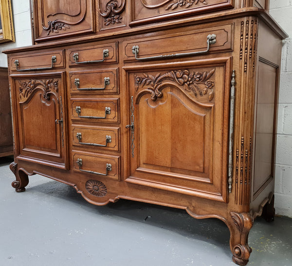 Beautiful 19th century Walnut Louis XV style sideboard with plenty of storage space. The top has two doors that open up to three adjustable shelves. It is in good original detailed condition.