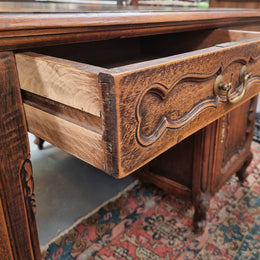 Fabulous Louis XV style French Oak beautifully carved full partners desk with an amazing tooled leather top. Both sides have a functioning drawer in the middle and two cupboards either side. On both sides one cupboard door opens up to four smaller internal drawers. Plenty of storage space and a large top surface to work on. It is in good original detailed condition.
