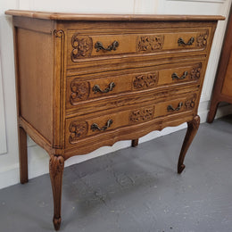 French Oak Louis 15th style nicely carved three drawer wooden top commode. It has been sourced from France and is in good original detailed condition.