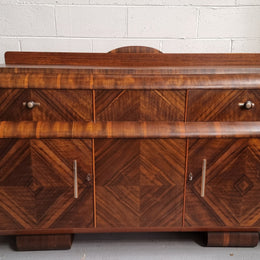 Vintage Walnut Art Deco “Waterfall” sideboard buffet with two drawers and two doors. It is in good original condition and has been sourced locally.