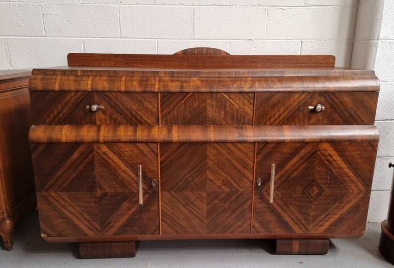 Vintage Walnut Art Deco “Waterfall” sideboard buffet with two drawers and two doors. It is in good original condition and has been sourced locally.