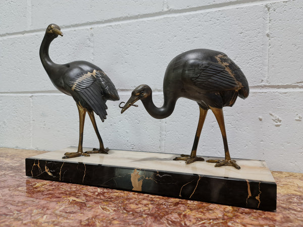 Fabulous French Art Deco cold painted spelter Ibis birds on a stylized Art Deco marble base. Signed "Rochard" circa 1930's. In good original detailed condition.