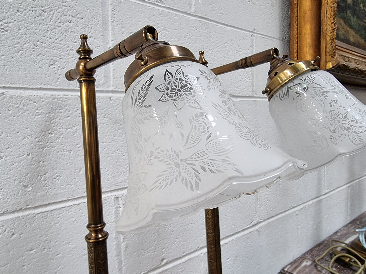 Pair of tall Antique style table lamps with glass floral etched shades. They have been sourced locally and are in good original detailed working condition.