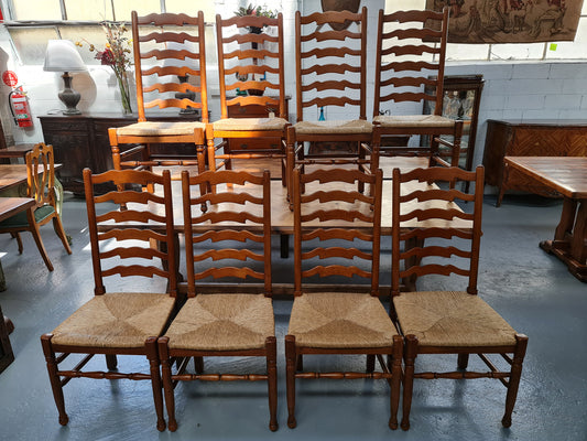 Charming set of eight Cherry Wood ladder back dining chairs. They are in good original detailed condition.