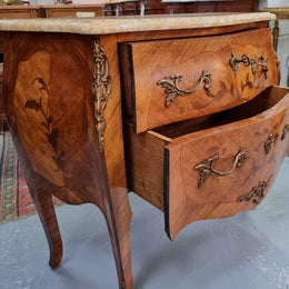 Fabulous French petite inlaid two drawer commode with ormolu mounts and lovely marble top. It is in good original detailed condition.