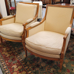 Pair of Louis XVI style 19th Century walnut upholstered Bergère chairs with loose cushions. They have been sourced from France and is in good original detailed condition. The fabric is in good original used condition, please view photos as they help form part of the description.
