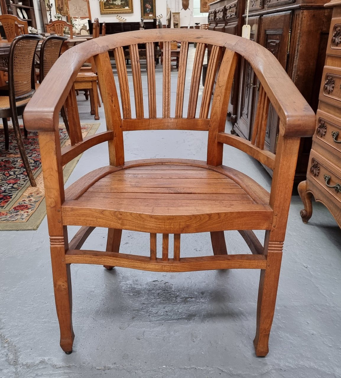 Vintage teak "Captains Chair". It is well built and very comfortable to sit in. It is in good original detailed condition.