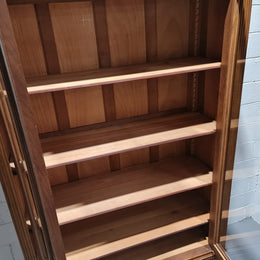 Stunning French Henry II style Walnut two door bookcase. In good original detailed condition.