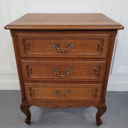 French Oak Louis XV style side drawers with lovely handles and three drawers. It has been sourced from France and is in good original detailed condition.