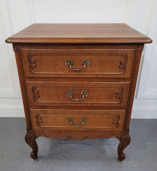 French Oak Louis XV style side drawers with lovely handles and three drawers. It has been sourced from France and is in good original detailed condition.