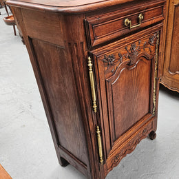Louis 15th style oak 19th century cabinet with lovely brass hinges, handles & charming carving.  Circ: 1860's. In good original condition.