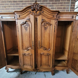 Amazing French Oak Louis XV style four door armoire. Plenty of storage space and beautifully carved throughout. In good original detailed condition and sourced from France. Please contact us for further photos.