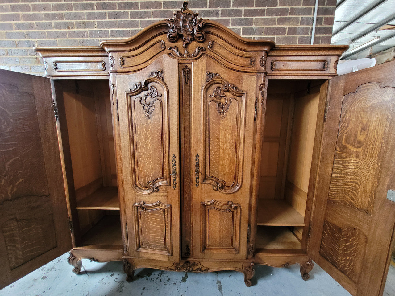 Amazing French Oak Louis XV style four door armoire. Plenty of storage space and beautifully carved throughout. In good original detailed condition and sourced from France. Please contact us for further photos.