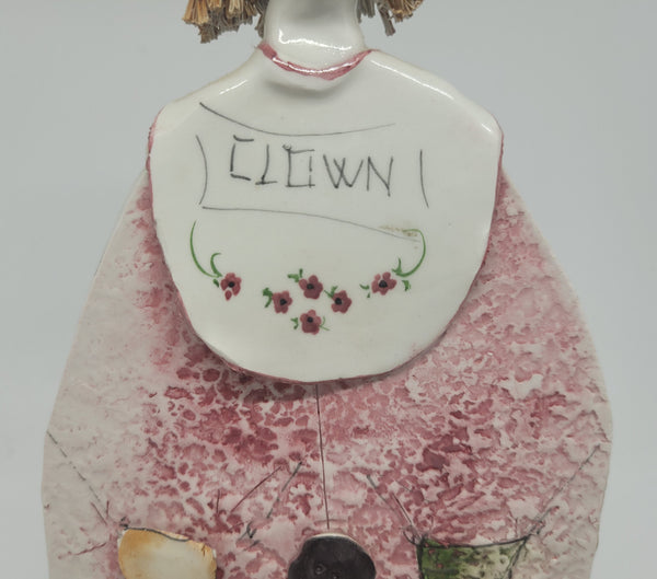 Signed pastel ceramic Italian clown figure. In good original condition.