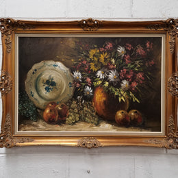 Beautiful signed oil on canvas of a still life framed in an ornate frame. Sourced in France and in good original condition.
