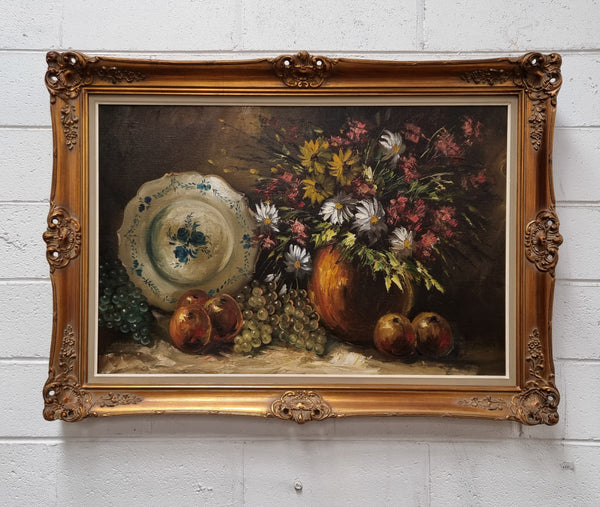 Beautiful signed oil on canvas of a still life framed in an ornate frame. Sourced in France and in good original condition.