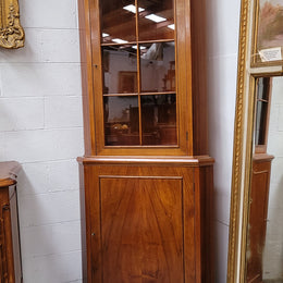 Practical Walnut corner cabinet with display and storage. Two shelf glass display on top and single shelf cupboard below. Sourced locally and in good original detailed condition.