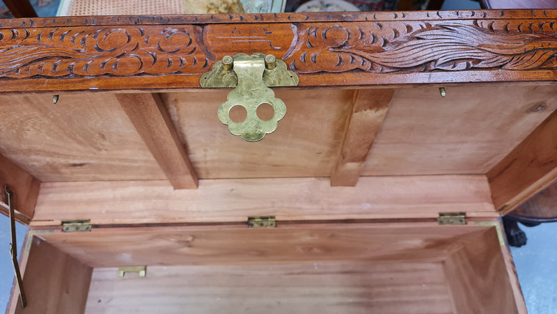 Vintage nicely carved Camphor wood chest. It has amazing carvings of boats, dragons and temples. It is in good original detailed condition.