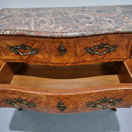 Attractive French marble top Louis XV style three drawer commode with decorative ormolu mounts. In good original detailed condition.