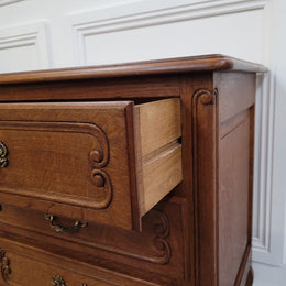 French Oak Louis XV style side drawers with lovely handles and three drawers. It has been sourced from France and is in good original detailed condition.