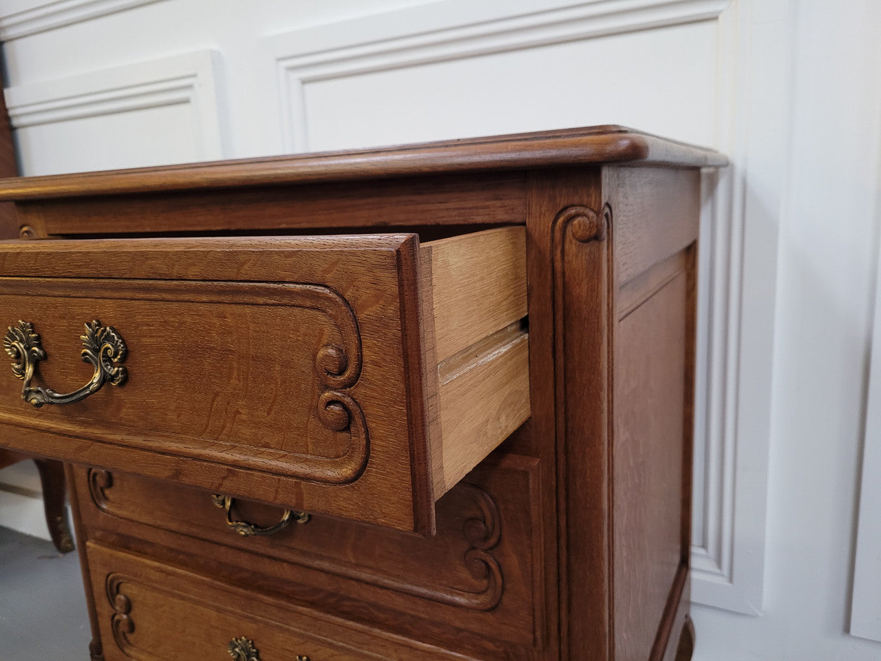 French Oak Louis XV style side drawers with lovely handles and three drawers. It has been sourced from France and is in good original detailed condition.