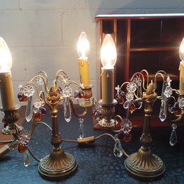 A stunning pair of French Bronze gilt Girandole candelabras, with lovely quartz drops. They are 36 cm tall and have been rewired to Australian standards. They are in very good original condition.