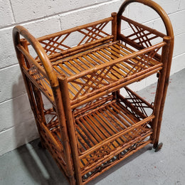 Excellent Vintage Tortoiseshell Bamboo two tier auto trolley. It has been sourced locally and is in fantastic original detailed condition .