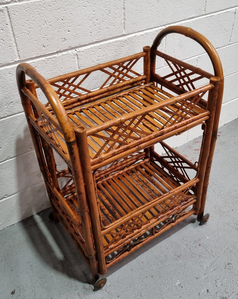 Excellent Vintage Tortoiseshell Bamboo two tier auto trolley. It has been sourced locally and is in fantastic original detailed condition .