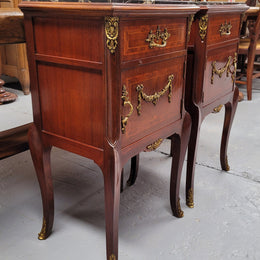 Appealing Louis XV style high quality bedside cabinets with black Portoro marble top and bronze mounts. They have been sourced from France and are in good original condition.