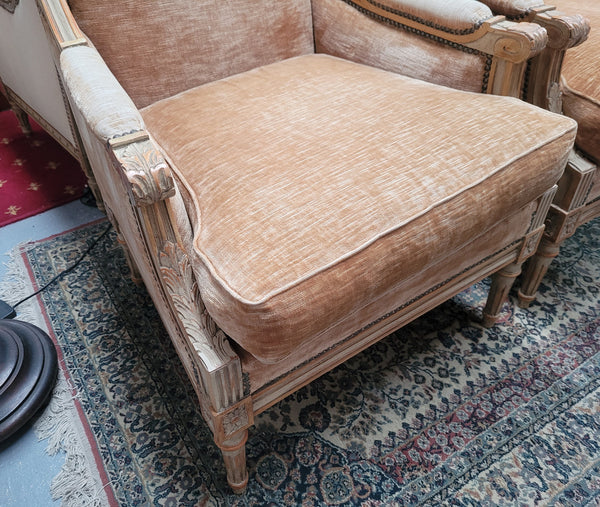 Pair of Louis XVI style painted arm chairs with carving & fluted legs. They have been sourced from France and the fabric is in good used original condition. Please view photos as they help form part of the description.