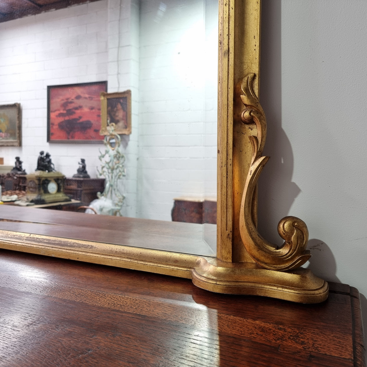 Antique arched over mantel gilt mirror. It has been sourced from France and is in good original detailed condition.