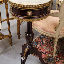 Elegant French louis XVI revival style round marble top side table with ceramic features and ormolu decoration. It is in good original detailed condition and has been sourced from France.