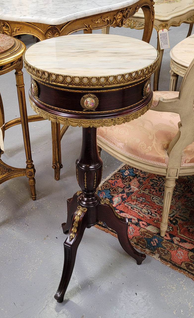 Elegant French louis XVI revival style round marble top side table with ceramic features and ormolu decoration. It is in good original detailed condition and has been sourced from France.