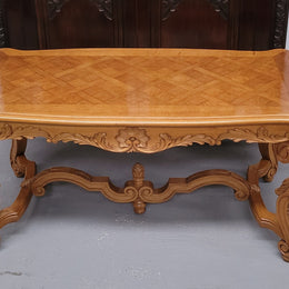French Oak parquetry top coffee table with decorative carved base. It is in good original detailed condition.
