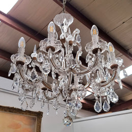 Sourced From France an attractive eight arm French crystal chandelier. It has been fully rewired to Australian standards and is in good original working condition.