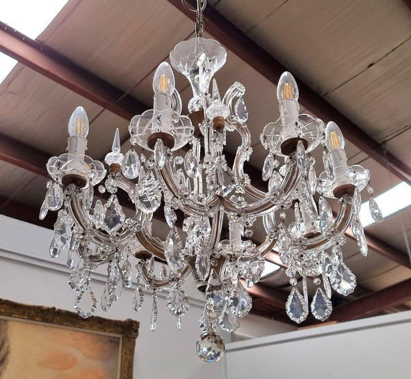 Sourced From France an attractive eight arm French crystal chandelier. It has been fully rewired to Australian standards and is in good original working condition.