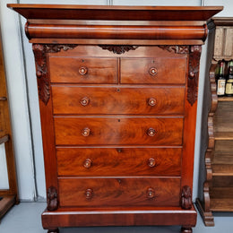 A 19th Century Scottish Flame Mahogany tall boy/ Chest of six drawers. Beautiful carvings and easily comes apart into three sections making transport o0r moving into place easy. In good original detailed condition.