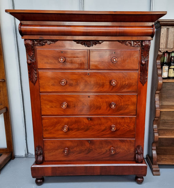 A 19th Century Scottish Flame Mahogany tall boy/ Chest of six drawers. Beautiful carvings and easily comes apart into three sections making transport o0r moving into place easy. In good original detailed condition.