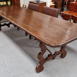 Amazing hard to find French Fruitwood Spanish style 3 meter dining table. Decorative iron work underneath and in good detailed original condition.