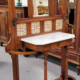 Late Victorian Arts and Crafts style marble top hall stand. Features three attractive tiles, original hooks and single drawer. In good original condition.